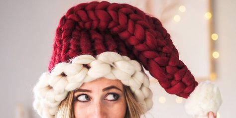 image Chunky Crochet Santa Hat, Playful Red Winter Hat, Oversized Beanie, Red Hand-knitted Yarn Hats, Pom Pom Decor, Christmas Pom Pom, Red Dahlia, Holiday Hats, Chunky Knitting