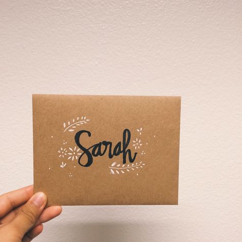 Hand drawn lettering by lisaharim // "Sarah" sharpie calligraphy envelope card. Black and white ink on kraft paper. Lettering Envelopes, Letter Envelope Design Ideas, Sarah Calligraphy, Hand Lettered Envelopes, Kraft Paper Drawing, Sarah Calligraphy Name, Birthday Card Calligraphy Hand Drawn, Sharpie Calligraphy, Envelope Art Wedding Hand Lettering