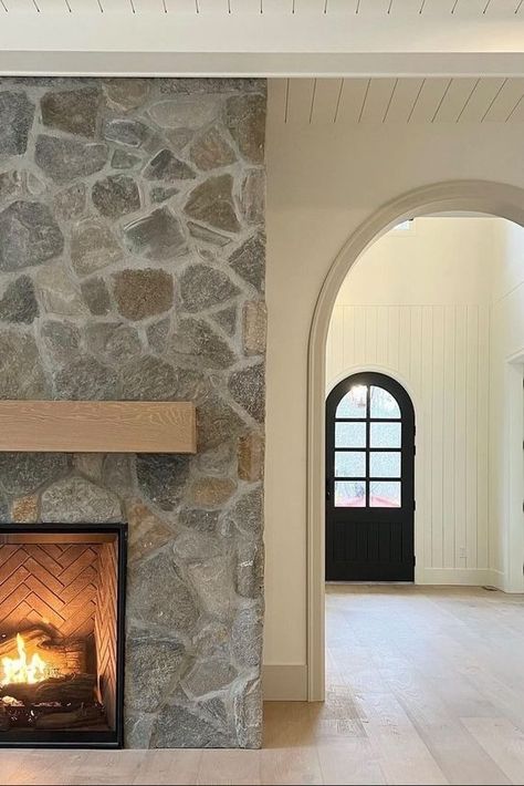 Please don’t bother us, we’re living our fairy tale dreams right now! Look at that door. Look at that double archway. Look 👏🏼 at 👏🏼 that 👏🏼 fireplace 👏🏼! We have absolutely no words for this charming space! A huge shout out to Wilk Masonry for this amazing installation! 🥳 Sucasa Design has blown us away with this home design, but are we surprised?! 😍 Stone And Shiplap Fireplace, Shiplap Farmhouse, Farmhouse Colonial, Design Fireplace, Fireplace Stone, Oregon House, Stone Landscaping, Natural Stone Veneer, Shiplap Fireplace