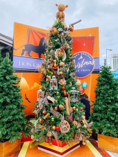 Find 22 Disney themed trees at the Christmas Tree Trail at Disney Springs Christmas Tree Disney Theme, Lion King Christmas Tree, Disney Christmas Tree Theme, Unique Christmas Tree Toppers Disney, Character Christmas Tree, Disney Theme Christmas Tree Mickey Mouse, Lion King Tree, Disney Inpsited Xmas Treee, Themed Trees