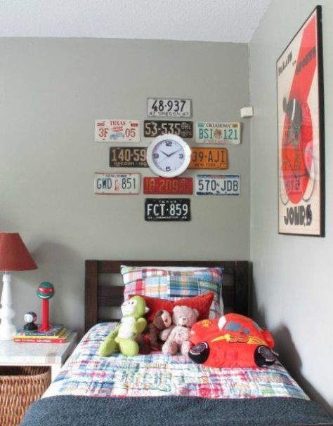 It started with a clock.  And a blank slate of a room.  Our 4-year-old son Lucas's room to be exact.   He'd asked for a clock since we'd moved in and I'd finally procured the perfect fit.   A sweet clock that was modern, bright, and simple... oh yeah, and super inexpensive.  (Ie: The stuff fist-pumps are made of). The question was how to hang it.   Lucas's room is transportation-inspired, so I wanted to include a few of the license plates that we had on hand.  I have plans to eventuall… How To Hang License Plates On The Wall, License Plates On Wall, Projects Using Old License Plates, License Plate Decor Wall Art, License Plate Wall Decor, Framed License Plate Wall Art, Wall Of License Plates, License Plates Diy, License Plate Wall