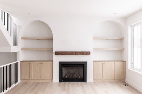 Arched Alcoves Living Room, Arches Next To Fireplace, Spanish Style Built Ins, Arched Built Ins Living Room Fireplace, Arch Entertainment Center, Lounge Room Shelving Ideas, Living Room With Built In Shelves, Fireplace Cubby Hole Ideas, Arch Media Wall