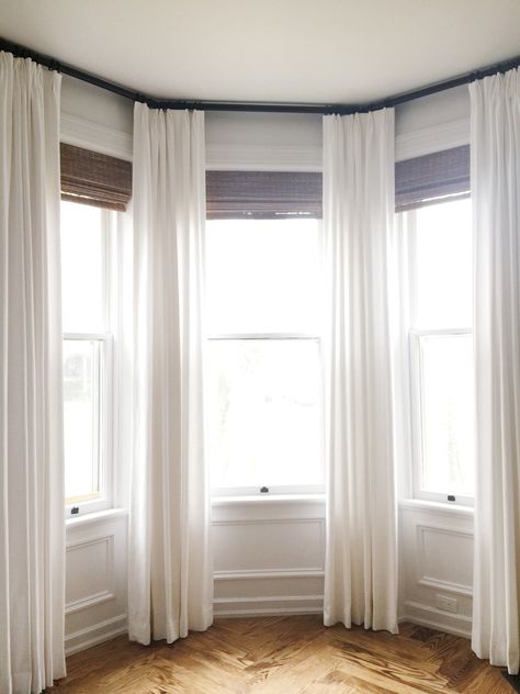 Curtains Around Bay Window, Bay Window Sheer Curtain Ideas, White Curtains Bay Window, Drapes On Bay Window, Three Bay Window Curtain Ideas, Long Curtains Bay Window, Curtains On Stairway Window, Bay Curtains Bedroom, Tall Bay Window Ideas