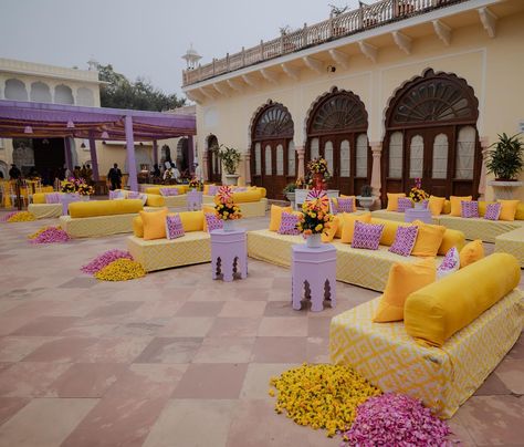 Sharvi and Ishaan’s Haldi decor, a perfect blend of tradition and modern flair at @thealsisarnahargarh 💛💜 Photos- @thewhitebox.in #alsisarmahal #alsisarnahargarh #nahargarhwedding #alsisarmahal #decorbykomal #inspiredesign #weddingdecoration #shaadisaga #decorbykomal #decorationinspo #indianwedding #luxurywedding #grandwedding #goaweddingplanner #goaweddingdecor #weddingdecorator #weddingsofinstagram # #floraldesign #flowerdecoration #weddingdecorideas @fabwedding @weddingz.in @shaadidukaa... Haldi Seating, Goa Wedding, Haldi Decor, Wedding 2025, Wedding Decor Inspiration, Sofa Seats, Prom Night, Hanging Lanterns, Event Management