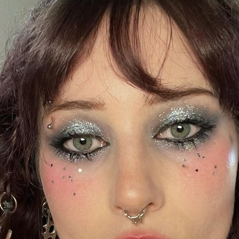 𝕤𝕠𝕡𝕙𝕚𝕒 𝕔𝕙𝕒𝕤𝕚𝕟 on Instagram: "so sparkly ✨ i loved how this looked but boy did it feel terrible on my eyes jewelry- necklace and septum: @regalrose (code: OATMILK15 for $ off) earrings: @aptfiive lip: etsy products- face: @smashboxcosmetics always on skin balancing foundation @rmsbeauty living luminizer @kaleidosmakeup contour trio in light, mono blush in pale rose eyes and eyebrows: @tartecosmetics in bloom @aboutfacebeauty shadowstick in kill the lights, line artist in into the void, fluid eye paint in art of darkness, fractal glitter in keep the change (code ABOUTSOPHIA20 for 20% off) @unicornsnot hidef glitter in beam @kaleidosmakeup black/grey quad palette lips: @charlottetilbury very victoria @kyliecosmetics tinted butter balm in moving on #silvermakeup #glittermakeup #sp Makeup Glitter Looks, Y2k Glitter Makeup, Punk Glitter Makeup, Glitter Alt Makeup, Rose Eyes, Silver Eye Makeup Editorial, Eyes Jewelry, Glitter Smokey Eye, Fairy Makeup Editorial