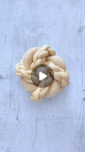 Idan Chabasov AKA Challah Prince™ official on Instagram: "Stretch your fingers and get ready for this one. This round challah is a true masterpiece for your holiday table. Braided with care and precision. 
What do you think, another fingerprint of Challah Prince? 

🍞Recipe for this beautiful round challah:
330g water
10g dry yeast
75g sugar
15g salt
75g olive oil
750g flour 

⚖️Dough Division Instructions:
The 4 main braided parts were made out of 4 strands each. 60g to each strand × 16 in total (240g to each challah)
Rolled into 24 inches length (60cm). 

The thick strand covered with sesame seeds made out of 240g of dough.
Length of 30 inches (75cm). 

The tiny dough ball for the top of the crown made out of 20g of dough. 

🧶Braiding techniques:
For the 4 braid technique, please check Challah Prince, Round Challah, Dough Balls, Challah, Dry Yeast, Holiday Tables, Yeast, Dough