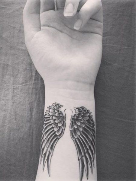 25 Cute Wrist Tattoos for Women in 2021 - The Trend Spotter Wing Wrist Tattoos For Women, Cross Thigh Tattoos For Women, Angel Wings Wrist Tattoo, Wings Tattoo For Women, Haley Tattoo, Inside Wrist Tattoos For Women, V Line Tattoos Women, Angel Tatoos, Angel Wing Wrist Tattoo