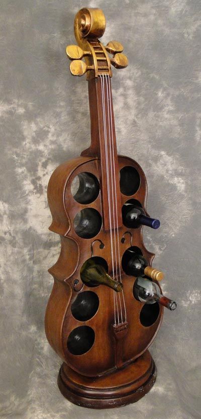 Cello wine rack  A Truly Instrumental Furniture Accessory that Functions as a Place to Hold 10 Wine Bottles - Resin and Wood Reproduction of an Actual Size Cello Musical Instrument Stands on Base - Bottles Shown But Not Included.Size: 47" High Music Furniture, Homemade Instruments, Instruments Art, Musical Art, Music Decor, Music Room, Bottle Holder, Musical Instrument, Diy Arts And Crafts