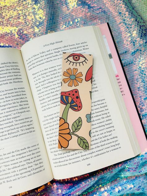 2” by 6” double sided laminated book mark -Will be shipped with unmarked tracking unless it’s an international order Bookmark With Books On It, Cute Bookmarks Design, Bookmark Ideas Color Pencil, Tie Dye Bookmarks, Book Maker Ideas, Gouache Mushroom Painting, Marker Ideas Drawing, Page Marker Ideas, Bookmark Craft Creative