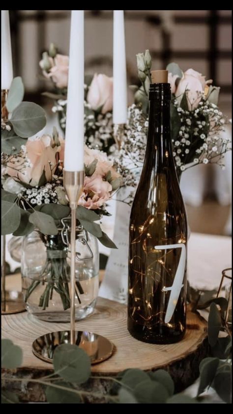 Centerpieces Wedding Wine Bottles, Alternating Table Centerpieces, Antique Bottle Centerpieces Wedding, Table Number Wine Bottle, Wine Bottle Vase Wedding, Diy Wine Bottle Wedding Decor, Wine Bottle Table Centerpieces, Wedding Decor With Wine Bottles, Wedding Table Decorations Wine Bottles