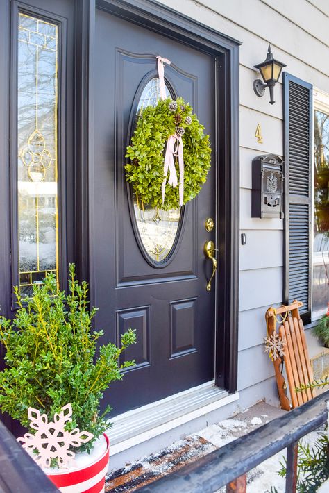 Boxwood Planters, Window Baskets, Door Handles And Locks, Front Door Makeover, Wood Snowflake, Black Shutters, Oval Window, Door Display, Black Front Doors