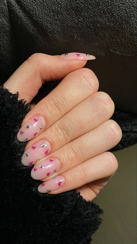 Heart And Rhinestone Nails, Nails With Hearts And Rhinestones, Valentines Nails Rhinestones, Pink Glitter Heart Nails, Nails With Pink Gems, Nails Rinstone Simple, Valentines Nails With Rhinestones, Light Pink Valentines Nails, Nails With Gems Rhinestones