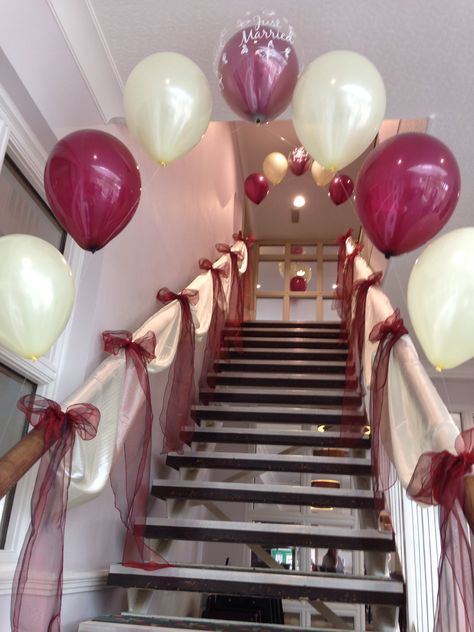 Wedding stair case dressing & entrance balloon arch on Burgundy & Ivory www.stylisheventsmk.co.uk Streamers On Stairs, Stairs Party Decoration, Birthday Stairs Decoration, Stairs Balloon Decoration, Entrance Balloon Arch, Wedding Stairs, Bike Couple, Stair Banister, Dinner Party Decorations