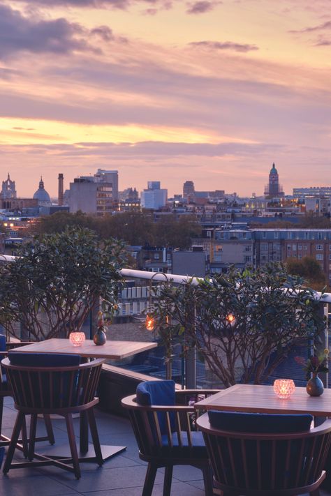 Enjoy the golden hour from this chic rooftop terrace of the Peninsula London Hotel, styled with cozy seating and warm ambient lighting. #RooftopTerrace #OutdoorLiving #SunsetView #Dornbracht London Rooftop, Stone Mosaic Floor, London Rooftops, London Hotel, Current Design Trends, Luxurious Spa, Royal Park, Cozy Seating, The Golden Hour