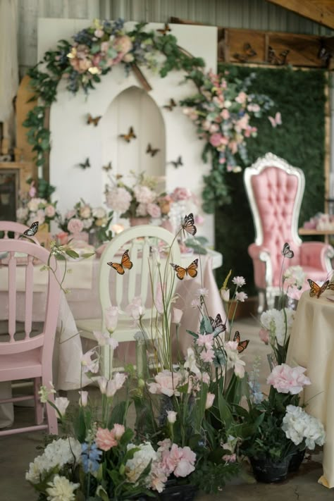 Butterfly-themed bridal shower setup with pastel chairs, pink flowers, and butterfly accents He Gives Her Butterflies Bridal, Wedding Shower Butterfly Theme, Enchanted Garden Bridal Shower Theme, Pink And Green Bridal Shower, Lifetime Of Butterflies Theme Bridal, Butterfly Wedding Shower Theme, He Gives Me Butterflies Shower Theme, March Bridal Shower Ideas, Butterfly Bridal Shower Ideas Decoration