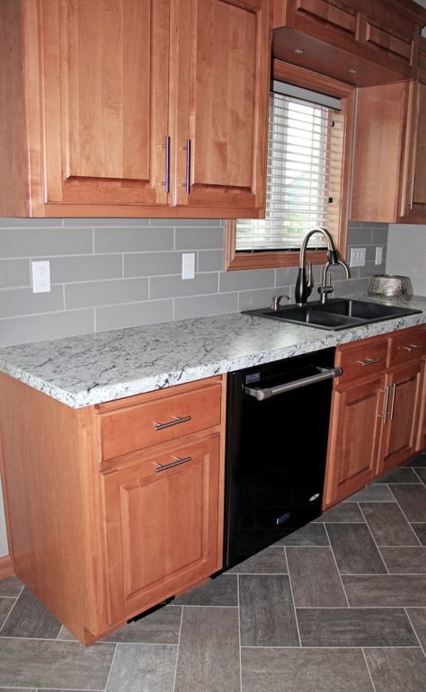 maple cabinets, gray backsplash tile, herringbone tile flooring Oak Cabinets Grey Floor, Wood Cabinets Grey Floor, Gray Backsplash Kitchen Wood Cabinets, Brown Cabinets Gray Floor, Backsplash For Black Granite Countertops, Gray Backsplash Tile, Grey Backsplash Kitchen, Cheap Backsplash, Gray Tile Backsplash