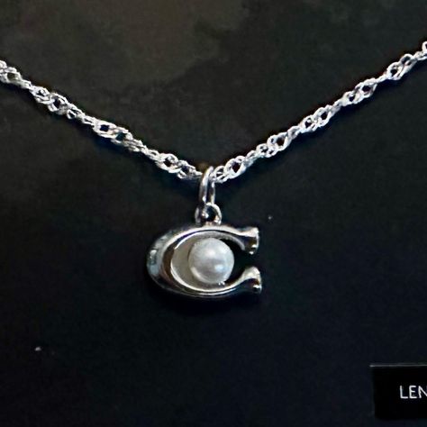 Brand New On Coach Jewelry Card And Absolutely Darling Describes This Authentic Coach Dainty Silver Faux Pearl “C”Pendant Beautifully Displayed On This Genuine .925 Sterling Silver Necklace. Designer Stamped Coach On Hang Tag. Necklace Measures 18” In Length. Lobster Claw Clasp. Coach Jewelry, Dope Jewelry, Jewelry Card, Girly Jewelry, Jewelry Inspo, Dream Jewelry, Piercing Jewelry, Sterling Silver Necklaces, Faux Pearl