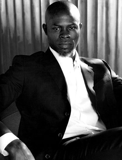 Black and white picture of Djimon Hounsou Djimon Hounsou, I Love Cinema, Black Hollywood, Black Celebrities, Sharp Dressed Man, African History, Well Dressed Men, Good Looking Men, Suit And Tie