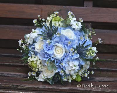 Bridesmaids co-ordinating bouquet using blue hydrangeas with white roses, stocks, aster and ornithogolum with thistles and silver eucalyptus Maggie Sottero Wedding Dresses Strapless, Wedding Flowers Blue, Rustic Wedding Blue, Rustic Wedding Colors, Rustic Bouquet, Maggie Sottero Wedding Dresses, Rustic Wedding Flowers, Rustic Wedding Venues, Rustic Blue