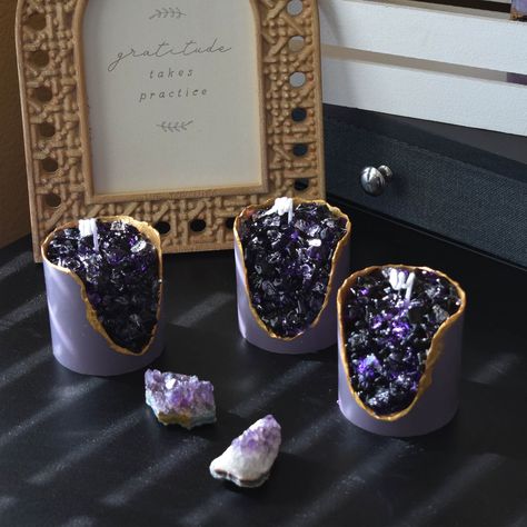 "Description: Illuminate your sanctuary with our \"Gemstone Glow\" candle, a masterpiece where the timeless elegance of amethyst crystals blends seamlessly with the gentle light of a soy candle. This exquisite hand-poured creation is designed to enchant the senses and infuse your surroundings with the purifying energy of amethyst. Features: -Handcrafted with Love: Each candle is meticulously crafted by hand, ensuring a unique and personal touch. -Luxurious Aroma: Choose from a selection of sophisticated scents to elevate your experience and provide a tranquil atmosphere. -Decorative Statement: The rich purple gemstones set against the creamy soy wax create a striking visual that doubles as elegant home decor. IMPORT -Each order is hand-colored and made by order, the color may vary slightly Gemstone Candles, Purple Gemstones, Purple Candles, Candle Glow, Amethyst Crystals, Candle Plate, Unique Mothers Day Gifts, Crystal Candle, Luxury Soap