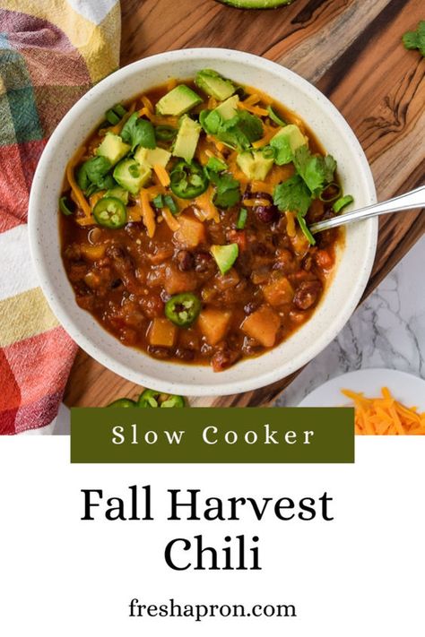 This Slow Cooker Fall Harvest Chili is full of all those delicious fall flavors, like butternut squash and pumpkin. It's a vegetarian chili recipe that's loaded with veggies and beans. Follow Fresh Apron for more Football Party Food. Harvest Chili Recipe, Harvest Chili, Squash Chili Recipe, Vegetarian Pumpkin Chili, Butternut Squash Slow Cooker, Family Vegetarian Meals, Vegan Entree Recipes, Pumpkin Chili Recipe, Crockpot Soups