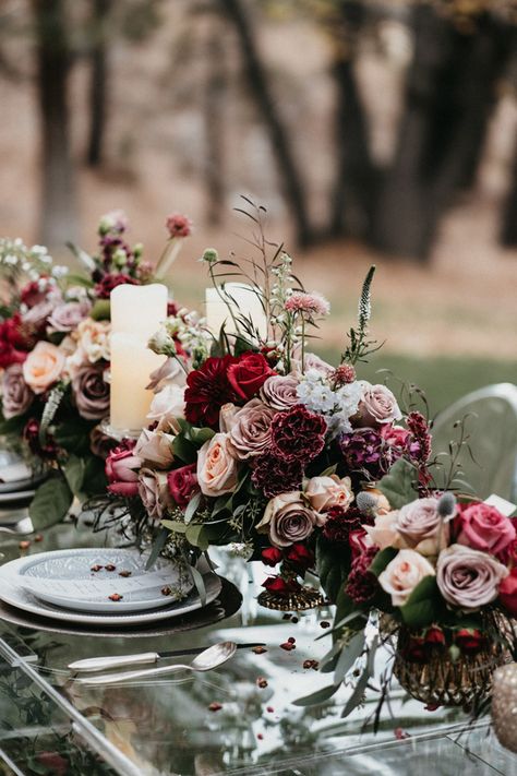 Short long table Wedding centerpiece with burgundy and mauve roses. Acrylic wedding tablescape - Quattro Studios #weddings #weddingflowers #centerpiece #weddingcenterpiece #weddingdecor #weddingdecorations #floral Garland And Flower Centerpiece, Mauve And Burgundy Wedding Flowers, Mauve Burgundy Green Wedding, Pink Burgundy Centerpieces, Long Wedding Table Flowers, Winter Fairytale Wedding, Burgundy And Mauve Wedding, Burgundy Flower Centerpieces, Mauve And Burgundy Wedding