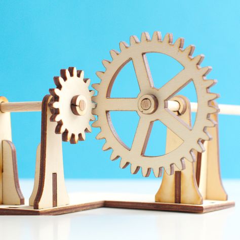 Laser cut right angle gear mechanism. The axels are made from wooden dowels. Marble Machine, Gear Design, Wooden Gears, Mechanical Gears, Beer Fridge, Bevel Gear, Laser Ideas, 360 Design, Nuts Bolts