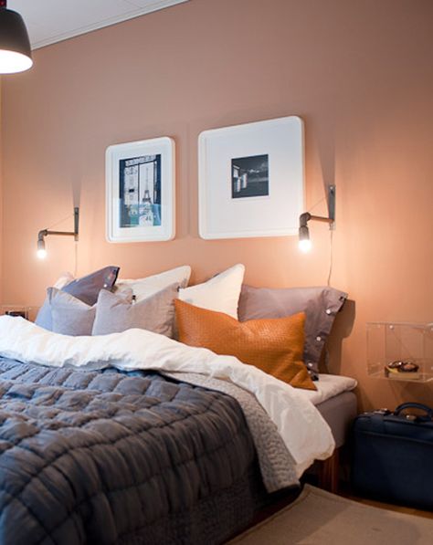 The color combination here minimizes the femininity of the peach wall color.  The dark mixed with the leather, mixed with the stark white gives the walls an opportunity to melt into the background so much more. Peach Walls Bedroom Decor, Peach Feature Wall, Bedroom With Peach Walls, Bedroom Peach Walls, Peach Wall Bedroom, Light Orange Bedroom Walls, Lavender Walls Bedroom, Peach Bedroom Walls, Orange Bedroom Walls