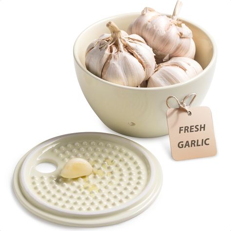 PRICES MAY VARY. Our Ceramic Garlic Keeper measures 5.12" L x 2.95" H, providing ample space to store up to three normal-sized garlic bulbs. The wide opening ensures easy access while maintaining an elegant presentation on your countertop. 6 vents around the garlic saver maximize airflow, keeping garlic dry. The ceramic lid blocks out light, extending shelf life of your garlic and reducing sprouting. Made of premium porcelain, our garlic holder is crafted for durability. It resists odor absorpti Garlic Grinder Ceramic, Garlic Keeper Pottery, Ceramic Garlic Keeper, Garlic Container, Garlic Holder, Garlic Tool, Ginger Grater, Garlic Keeper, Garlic Bulbs