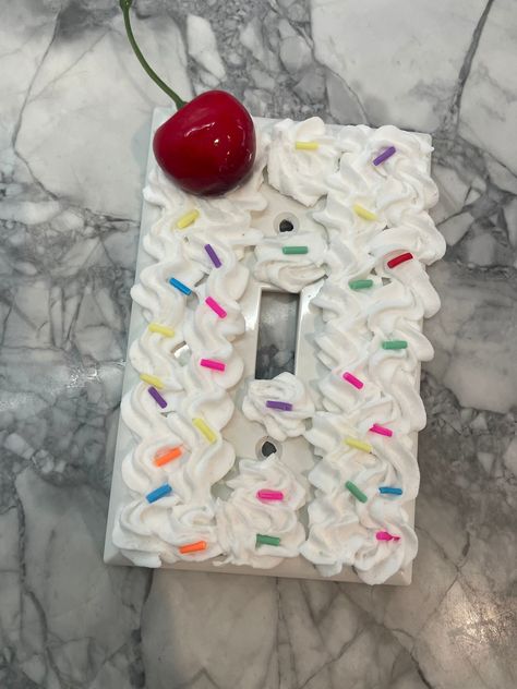 Super cute light switch cover. Made with faux sprinkles, frosting and a shiny cherry on top! Adorable for a little girls room! Fake Cake Ideas Diy, Candy Themed Room, Birthday Cake Y2k, Outlet Covers Painting, Candy Themed Bedroom, Candy Room, Room Makeup, Faux Cake, Bakery Crafts