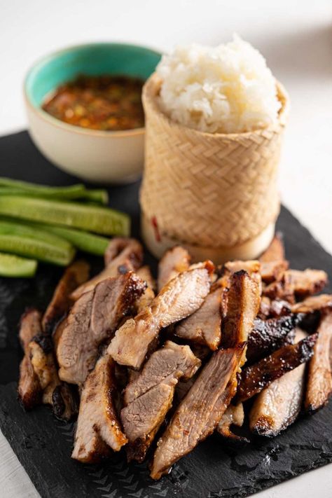 This Thai style grilled pork neck or grilled pork jowl is super DELICIOUS and easy to make. Pair it with sticky rice and nam jim jaew (Thai chili dipping sauce) and I guarantee that you’ll be satisfied! #thaigrilledporlneck #thaigrilledporkjowl #grilledpork #thaifood #thairecipe #kormooyang #kormooyaang #isanfood #namjimjaew #stickyrice #thaichilisauce #อาหารอีสาน #อาหารไทย #คอหมูย่าง #น้ำจิ้มแจ่ว Make Sticky Rice, Pork Jowl, Asian Candy, Thai Foods, Thai Salads, Thai Chili, Thailand Food, Thai Dishes, Sticky Rice