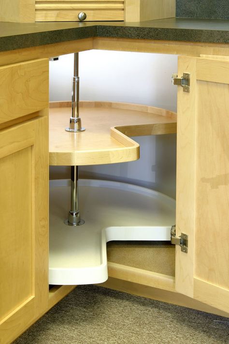 Steal back lost (and precious) storage in the far-away corners of cabinets by installing a lazy Susan. This turntable organizer also makes it easier to find containers that have been shoved to hard-to-reach corners. Lazy Susan Cabinet Organization, Corner Cabinet Solutions, Kitchen Cabinets Storage Organizers, Lazy Susan Cabinet, Kitchen Corner Storage, Diy Cabinet Doors, Corner Storage Cabinet, Cheap Kitchen Cabinets, Corner Kitchen Cabinet