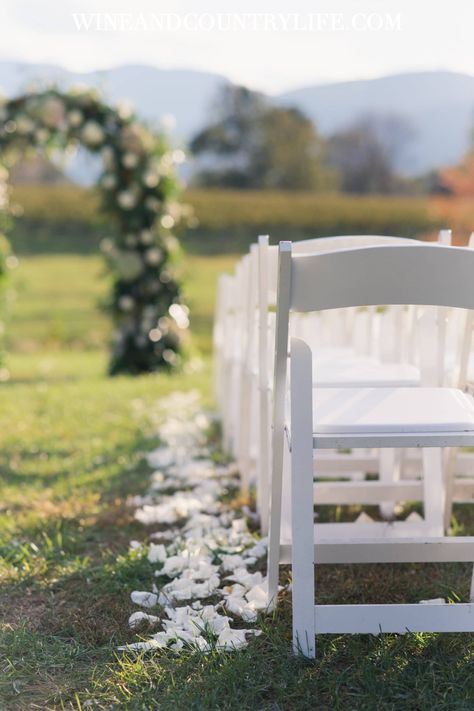 Fall vineyard wedding ceremony setup inspiration. Fine more vineyard and winery wedding inspiration and ideas on Wine & Country Weddings. Photo by: Beth Seliga of 3 Cats Photo Venue & Catering: Veritas Vineyards & Winery Ceremony décor, white folding chairs, petal trail, petals on aisle, fall vineyard wedding, Veritas Vineyard & Winery, fall wedding ideas, Real Wedding, Reception Décor, Virginia wedding, Virginia wine country, wedding of the year winner, Winery Winery Ceremony, Vineyard Wedding Ceremony, Fall Vineyard Wedding, Virginia Vineyard Wedding, Country Wedding Signs, Fall Vineyard, Wedding Ceremony Setup, White Folding Chairs, Setup Inspiration