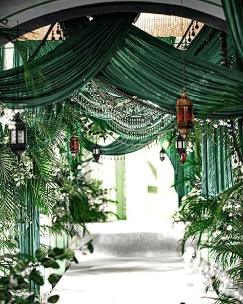 Draped from the ceiling, a shiny emerald velvet fabric makes for a stylish way to enhance the luxury of your wedding venue decor. Visit us to whet your imagination and explore enchanting possibilities to create the emerald and gold wedding of your dream! Emerald Wedding Colors, Emerald Green Wedding Theme, Green Wedding Decorations, Draping Wedding, Wedding Ceiling, Livingroom Sofa, Gold Wedding Inspiration, Green Themed Wedding, Emerald Green Weddings