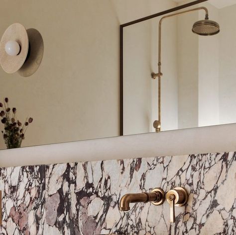 Vogue Living on Instagram: "Striking Calacatta Viola marble is one of the standouts in this Paris apartment devised by @edomapellimozzi of @banda.property. “The compact space required thoughtful design as the client wanted a large shower, plenty of storage and sculptural but effective lighting,” says Mozzi. “The central plinth houses the marble basin and the side plinths provide useful storage.” Click the link in our bio to take the full tour. 📷: @michaelsinclair Interior design: @banda.propert Calacatta Viola Powder Room, Calacatta Viola Marble Bathroom, Calcutta Viola Bathroom, Calacatta Viola Bathroom, Viola Marble Bathroom, Textured Plaster Walls, Banda Property, Bathroom Splashback, Marble Bathrooms