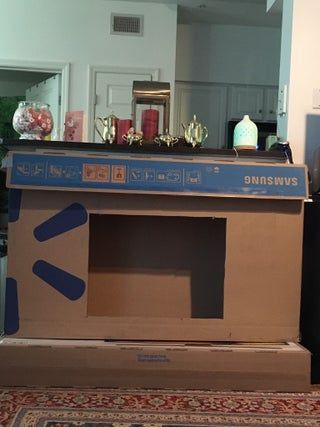 Cardboard Electric Fireplace, Diy Fireplace For Classroom, How To Make A Cardboard Fireplace, Diy Christmas Fireplace Cardboard Easy, How To Make A Fireplace Out Of Boxes, Box Fireplace Cardboard, Fake Fireplace Ideas Christmas, How To Make A Fireplace, Diy Fake Fireplace Cardboard