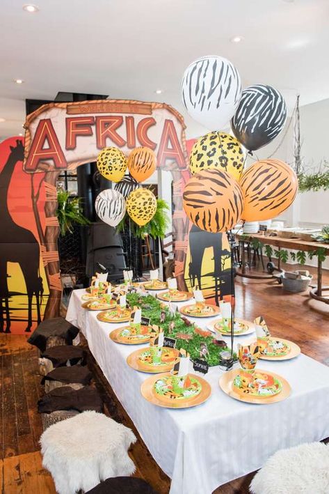 The table settings and party decorations at this African Safari 1st Birthday Party are so much fun! See more party ideas and share yours at CatchMyParty.com #catchmyparty #safaribirthdayparty #safari1stbirthdayparty #safari1stbirthdayparty #boybirthdayparty Africa Theme Party, Safari Birthday Party Ideas, Africa Party, Safari 1st Birthday, Safari Party Decorations, Jungle Theme Birthday Party, Jungle Theme Birthday, Birthday Table Decorations, Jungle Safari Party