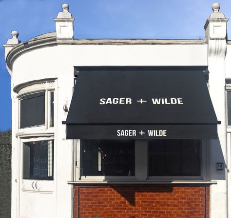 These Greenwich awnings, installed recently on the popular Sager + Wilde Restaurant and wine bar, Hackney, are covered with one of our fine textured black awning fabrics which complement the all black framing of the hardwood timber boxes and powder coated steel arms Black Awning, Restaurant Remodel, Shop Awning, Wine Branding, Black Restaurant, Hipster Aesthetic, Sign Inspiration, Cafe Black, Shop Facade