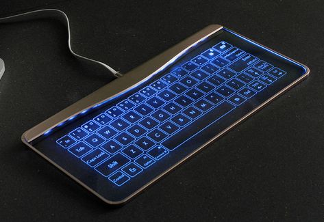 This superslim device is a keyboard, mouse and touch-sensitive gesture controller in one. Made of sleek aluminum alloy and tempered glass Futuristic Keyboard, Futuristic Computer, Clever Inventions, Computer Gadgets, Virtual Keyboard, New Technology Gadgets, Kids Electronics, Cool Electronics, Geek Gadgets