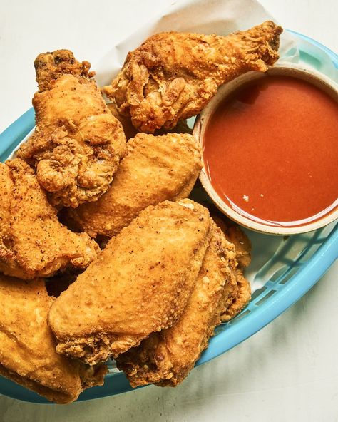 fried chicken wings in a turquoise basket, with buffalo sauce in a white ramekin on the side. Nashville Hot Chicken Tenders, Hot Chicken Tenders, Chicken Wing Sauce Recipes, Crispy Fried Chicken Wings, Deep Fried Chicken Wings, Chicken Wing Recipes Fried, Fried Chicken Recipe Southern, Wing Sauce Recipes, Chicken Wing Recipes Baked