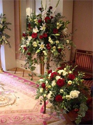 front facing arrangement including red roses and white lilies Pedestal Arrangements, Alter Arrangements, Pembroke Lodge, Altar Arrangements, Malaysia Wedding, Alter Decor, Urn Arrangements, Church Wedding Flowers, Wedding Parties Colors