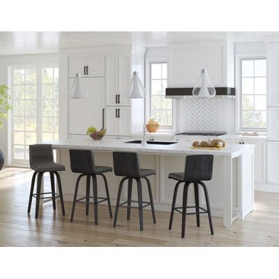 You may finally be able to enjoy a cup of coffee at your kitchen island with this stool before real life catches up. The four legs are made from wood with a walnut or black finish and are supported by a metallic square crossbar that you can rest your feet on. The L-shaped seat has a low back and is upholstered in foam-filled faux leather with stylish channel stitching across the seat and back. Plus this seat swivels so you can twirl for days. Wade Logan® Seat Height: Counter Stool (26" Seat Heig Grey Counter, Black Counter Stools, Leather And Wood, Leather Bar Stools, Wood Counter, Leather Bar, Bar Counter, Swivel Bar Stools, Mid Century Modern Design