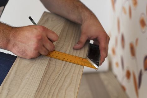 As it's almost impossible to purchase the exact amount of laminate flooring you need, you may find yourself with some leftover planks after installing it. Keep a few planks aside in case you ever need to repair your floor, but consider using the rest for craft projects. Vynal Flooring, Laminate Flooring Diy, Pallet Signs Diy, Scrap Projects, Pergo Flooring, Light Hardwood Floors, Wood Laminate Flooring, Wide Plank Flooring, Wood Ideas