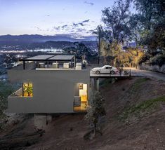 Car Park House by Anonymous Architects Slope House Design, Hillside Villas, Sloping Lot House Plan, House In Los Angeles, Slope House, Steve King, Garage Apartment Plans, Hillside House, House On Stilts