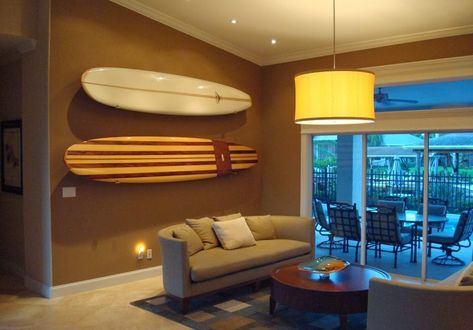 How To Store Surfboards, Paddle Boards, And Beach Cruisers Surfboard On Wall, Surf Storage, Surfboard Display, Sri Lanka House, Workout Room Ideas, Paddle Board Storage, Surfboard Storage, Surf Store, Surf Rack