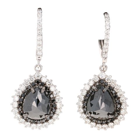 The most stunning black diamond earrings! Classy and Chic! These beauties have 2 Black Pear Cut Diamonds that weigh 8.81 Carats and 66 Round Cut Diamonds that weigh 1.66 Carats. Also adorned with 46 smaller black diamonds as a halo weighing 0.55 Carats. The total carat weight of the earrings are 11.02 Carats. The length of the earrings are 1.5 inches. They are curated in 14 Karat White Gold and weigh approximately 7.9 grams. Gold Diamond Drop Earrings, Colored Diamond Jewelry, Black Royalty, Oc Outfits, Black Diamond Earrings, Mexican Fire Opal, Fantasy Closet, Pear Cut Diamond, Diamond Drop Earrings