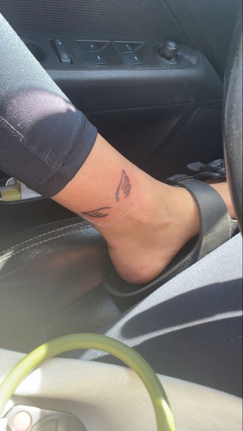 Wing Tattoo On Ankle For Women, Angel Wings Tattoo On Leg, Angel Wing Tattoo On Ankle, Angel Wings Back Of Arm, Angel Wings On Ankle, Angel Wings On Back Of Arm, Ankle Tattoo Inside, Roman Numeral Tattoo With Angel Wings, Wing Tattoo Placement