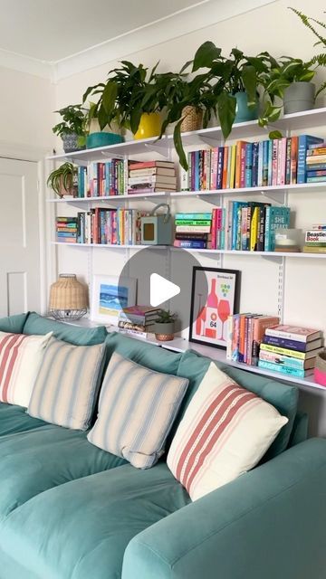 Emma on Instagram: "A little Saturday revamp for this room. As you know it’s taken ages to paint this room as I ran out of paint halfway through. Anyway I’m sort of glad I did as it gave me time to decide what to do with this wall before I pushed the couch back. I always need more book storage so shelves are perfect, plus I can move these around on the tracks if I want a change up. I honestly couldn’t face planning another gallery wall. Have a lovely Sunday ☀️ . . #myspaceanddecor #shelvesofinstagram #shelfiesunday #shelfielove #bookstack #myhousethroughalens #interiorrebellion #myhouseandhome #myhousemadehome #myhousethismonth #myinteriorvibe #myinteriorsquares #myinspiringinterior" Track Shelving Behind Couch, Bookshelf Over Couch, Books Above Couch, Bookshelves Behind Couch, Shelving Behind Couch, Bookshelf Behind Couch, Shelves Behind Couch, Track Shelving, Behind Couch