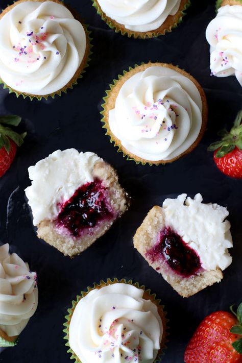 Berry Filled Vanilla Cupcakes Berry Cupcakes Recipes, Vanilla Berry Cupcakes, Chocolate Berry Cupcakes, Cupcakes With Fruit Filling, Berry Filled Cupcakes, Mixed Berry Cupcakes, Vanilla Raspberry Cupcakes, Huckleberry Cupcakes, Vanilla Cupcakes With Filling