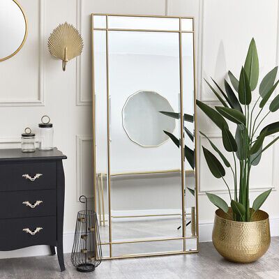 https://mirrorselect.com/          This Large Gold Framed Art Deco Wall / Leaner Mirror is a striking full length mirror, perfect for lovers of gold decor and metallic finishes. Made of wood, metal and glass, this mirror has a large rectangular shape and comes with an antique gold cross over metal frame and bevelled glass.    A lovely mirror choice for placement in a bedroom, hallway, living room or bathroom space. This mirror could easily blend into vintage, art deco or contemporary style… Large Art Deco Wall Mirror, Large Mirror In Hallway, Master Room Decor Ideas Modern, Large Gold Mirror Living Room, Large Mirror In Dining Room, Long Gold Mirror, Mirror At End Of Hallway, Floor Length Mirror Bedroom, Large Mirror In Bedroom